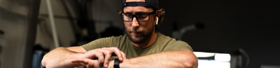 working out in athletic gear wearing sportrx prescription eyeglasses